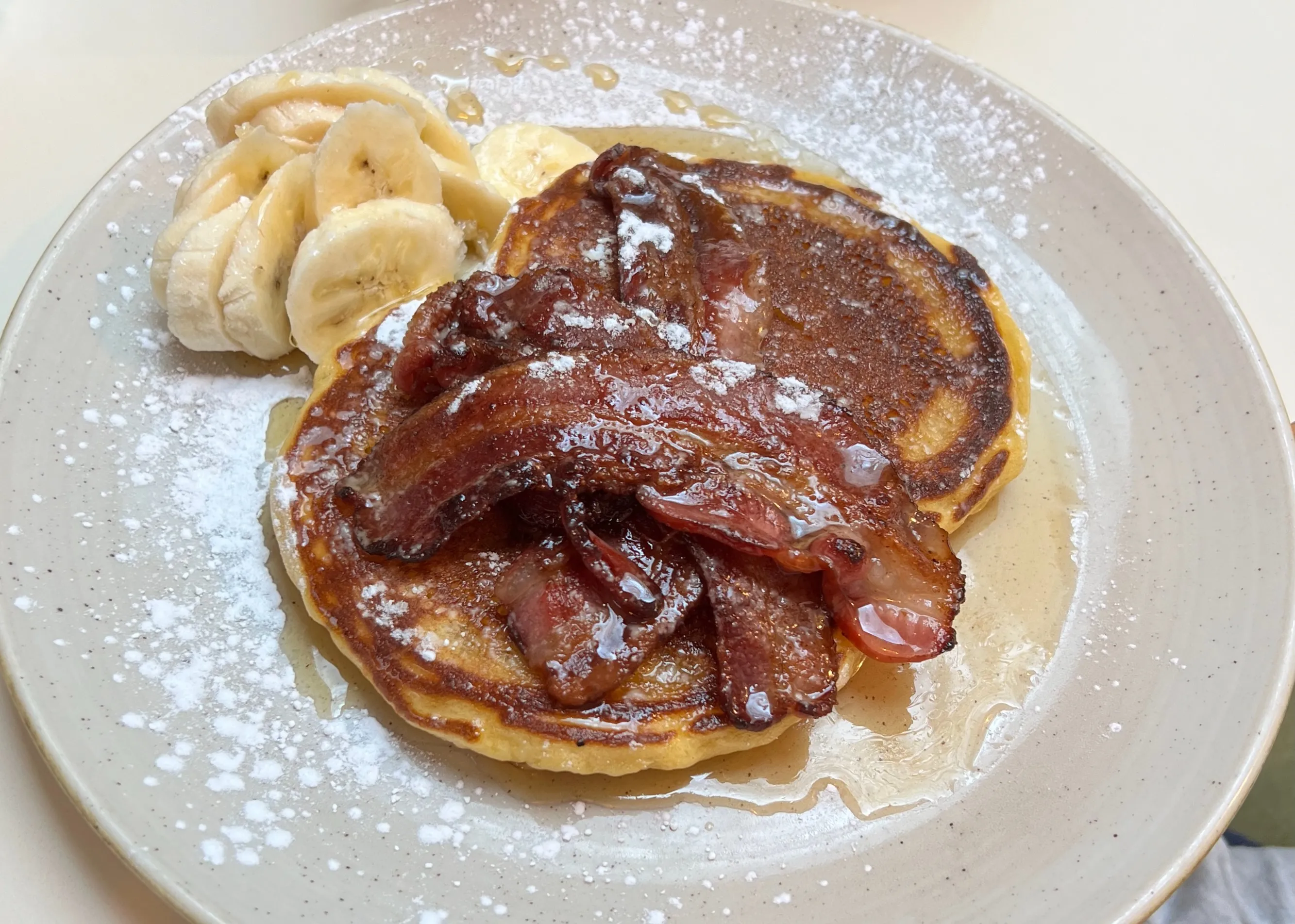Kid's Mini pancakes, customised with just banana, maple syrup and bacon