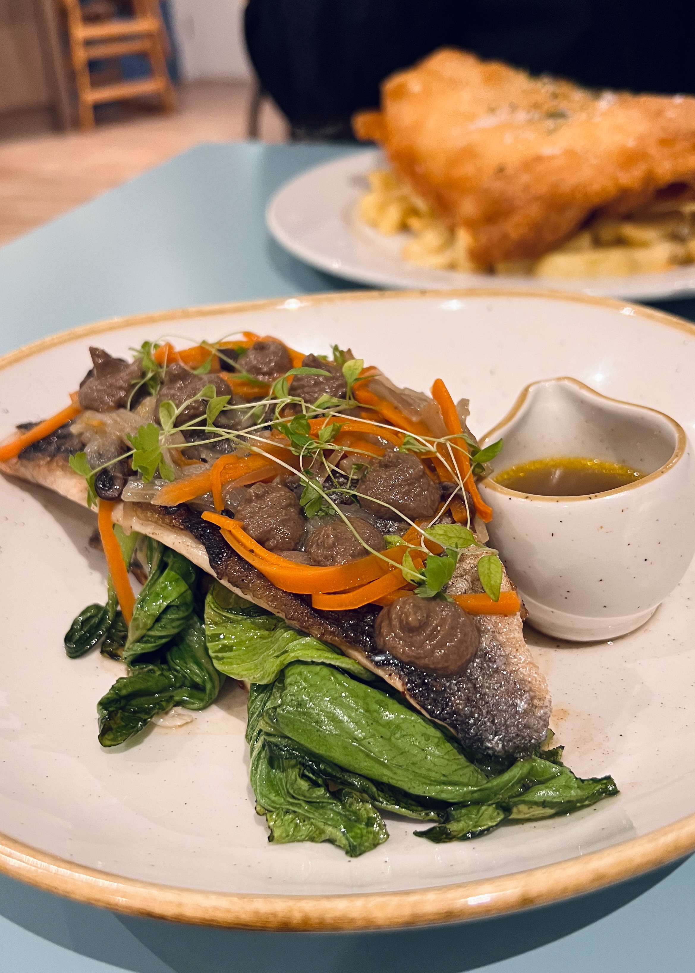 Sea bass for me, fish and chips for him